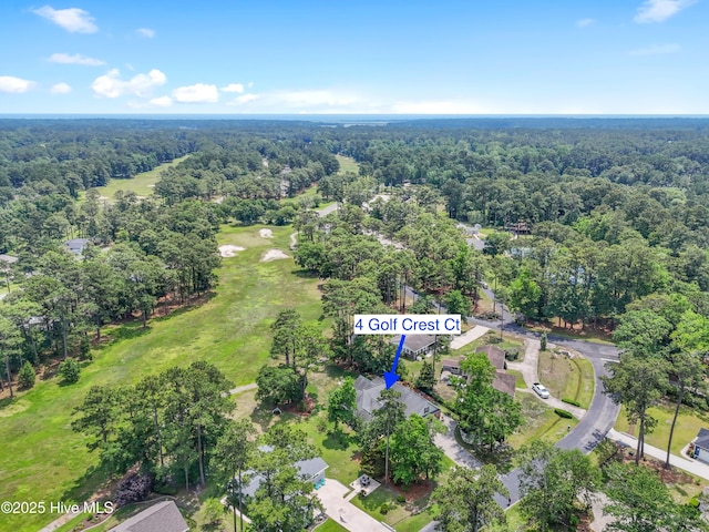 4 Golf Crest Ct, Carolina Shores, NC 28467 - aerial overview of property's location with a heavily wooded area