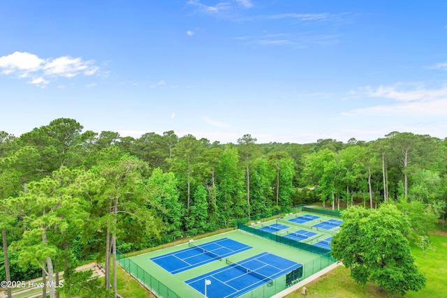 4 Golf Crest Ct, Carolina Shores, NC 28467 - view of tennis court featuring a forest view