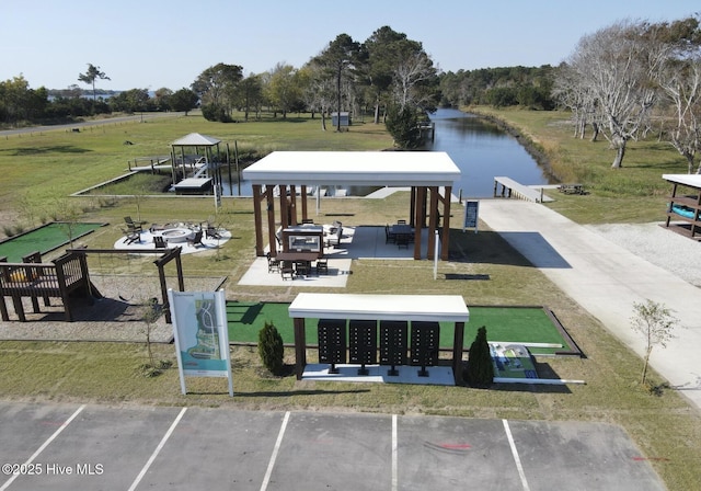 309 River Oats Ct, Holly Ridge, NC 28445 - view of community with a gazebo, mail area, a water view, uncovered parking, and a yard