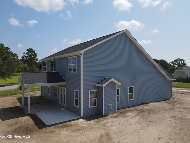 309 River Oats Ct, Holly Ridge, NC 28445 - back of property with a patio area