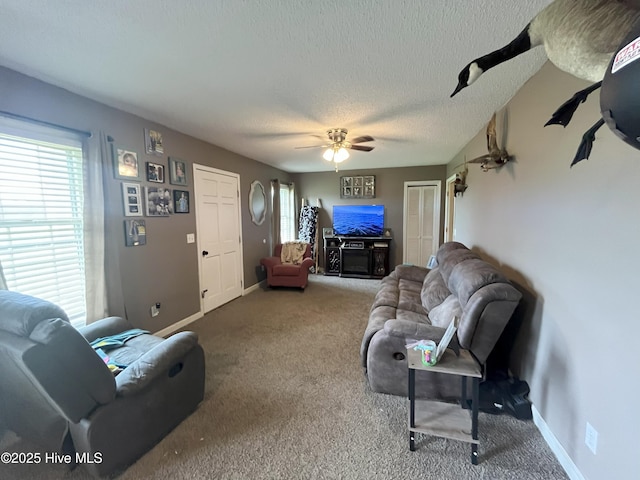 1076 Corbett Town Rd, Snow Hill, NC 28580 - carpeted living area with a textured ceiling, baseboards, and a ceiling fan