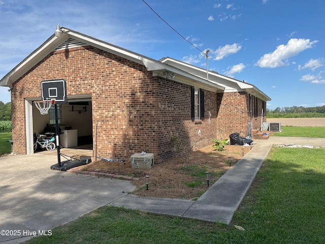 1076 Corbett Town Rd, Snow Hill, NC 28580 - view of home's exterior featuring brick siding, driveway, and a garage