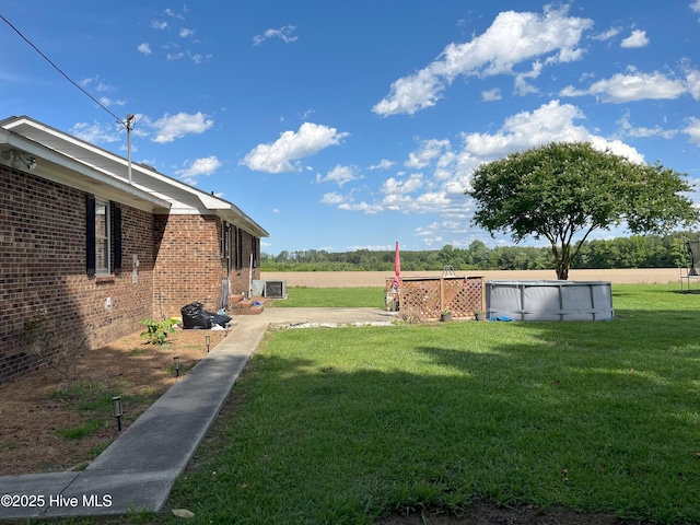 1076 Corbett Town Rd, Snow Hill, NC 28580 - view of green lawn with a covered pool and central AC