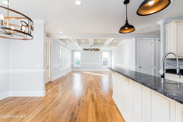 110 Dow Rd N, Carolina Beach, NC 28428 - unfurnished dining area featuring a chandelier, crown molding, a sink, coffered ceiling, and beamed ceiling