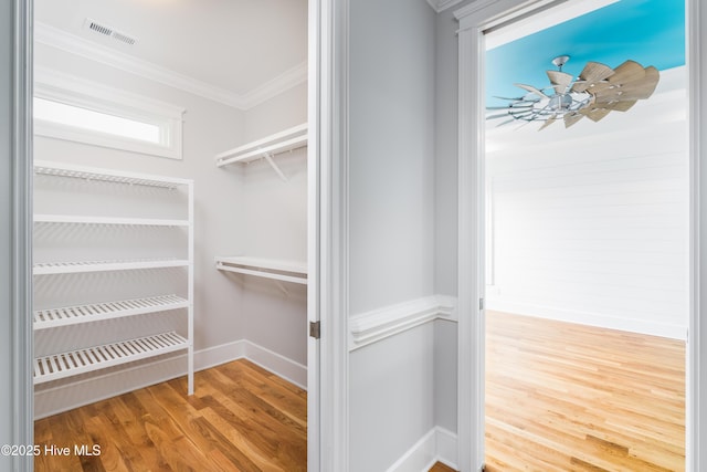 110 Dow Rd N, Carolina Beach, NC 28428 - spacious closet featuring wood finished floors