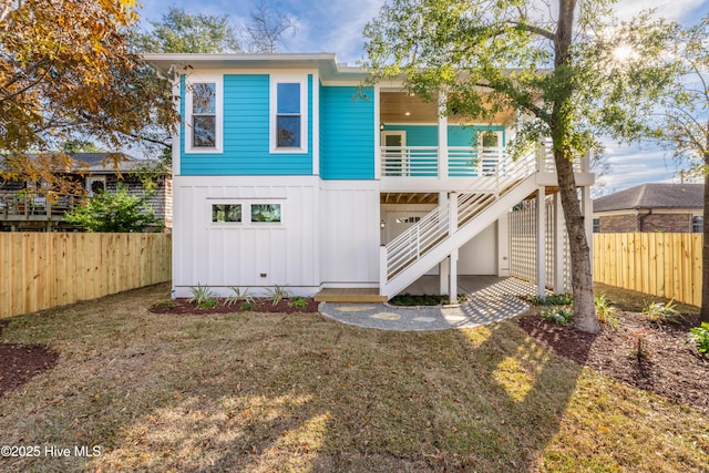 110 Dow Rd N, Carolina Beach, NC 28428 - back of property with board and batten siding and stairs
