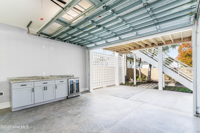 110 Dow Rd N, Carolina Beach, NC 28428 - garage featuring beverage cooler and baseboards