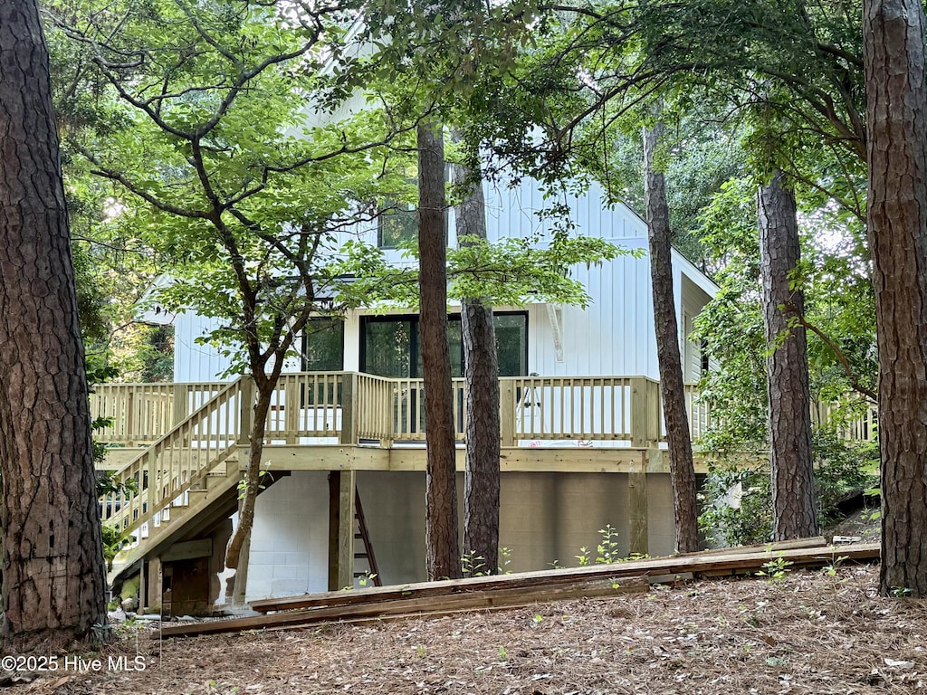 126 Willow Rd, Pine Knoll Shores, NC 28512 - rear view of house with stairway and a wooden deck