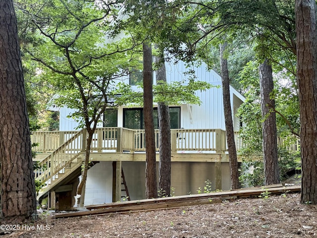 126 Willow Rd, Pine Knoll Shores, NC 28512 - rear view of house with stairway and a wooden deck