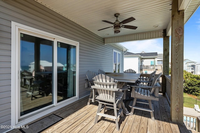 1905 Emerald Dr, Emerald Isle, NC 28594 - wooden deck with outdoor dining space and a ceiling fan