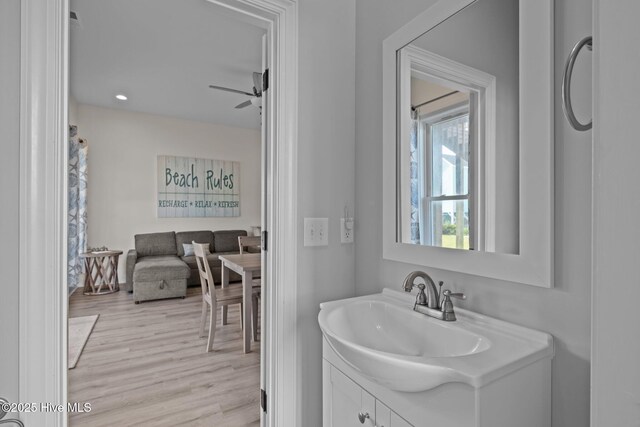 1905 Emerald Dr, Emerald Isle, NC 28594 - bathroom with vanity, wood finished floors, and ceiling fan