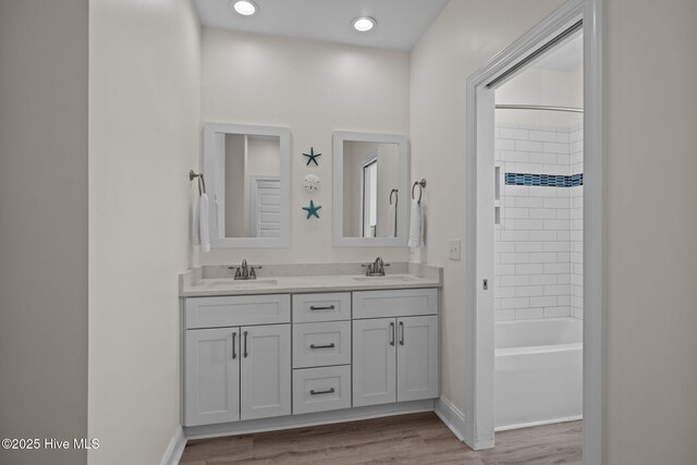 1905 Emerald Dr, Emerald Isle, NC 28594 - full bath with double vanity, wood finished floors,  shower combination, and baseboards
