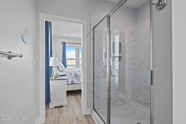 1905 Emerald Dr, Emerald Isle, NC 28594 - bathroom with ensuite bathroom, a marble finish shower, wood finished floors, and baseboards