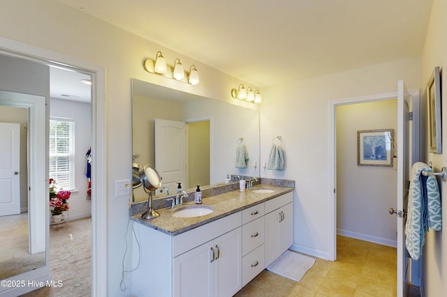 205 River Oats Ct, Holly Ridge, NC 28445 - bathroom with double vanity, baseboards, and tile patterned floors