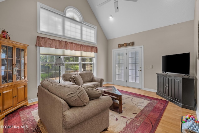 550 Sunset Lakes Blvd SW, Sunset Beach, NC 28468 - living room with high vaulted ceiling, ceiling fan, wood finished floors, and baseboards