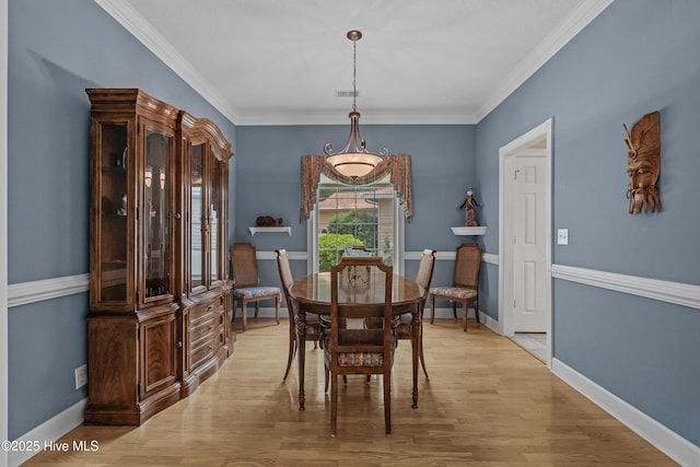 550 Sunset Lakes Blvd SW, Sunset Beach, NC 28468 - dining space featuring light wood finished floors, ornamental molding, and baseboards