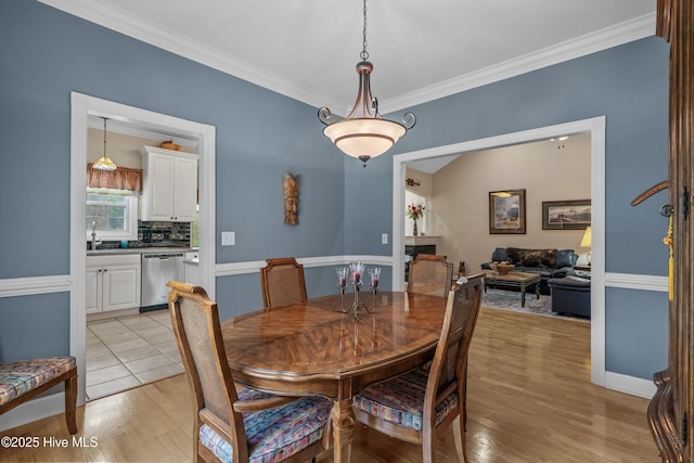 550 Sunset Lakes Blvd SW, Sunset Beach, NC 28468 - dining space with crown molding and light wood finished floors