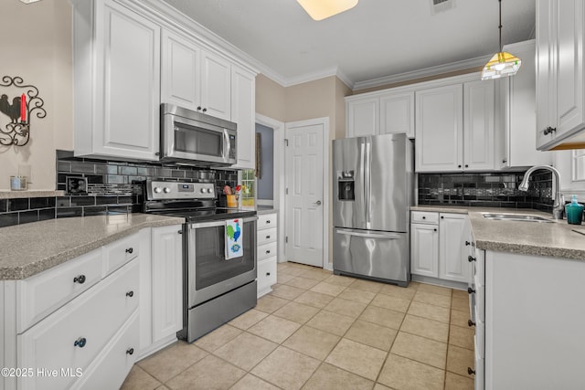 550 Sunset Lakes Blvd SW, Sunset Beach, NC 28468 - kitchen with stainless steel appliances, a sink, decorative backsplash, white cabinetry, and crown molding