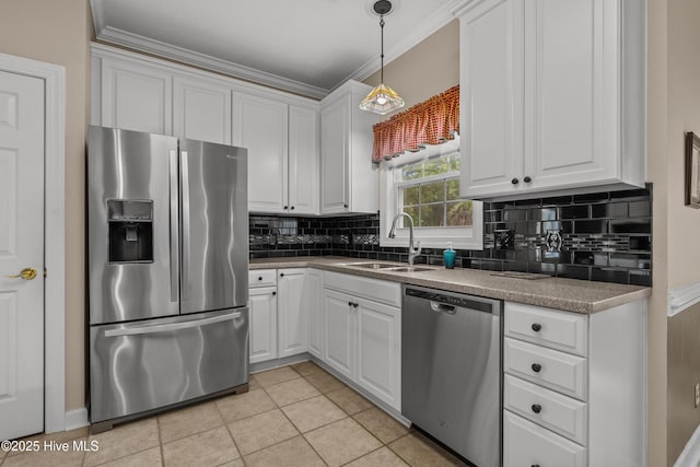 550 Sunset Lakes Blvd SW, Sunset Beach, NC 28468 - kitchen with stainless steel appliances, a sink, decorative backsplash, light tile patterned floors, and white cabinets