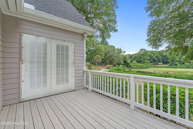 550 Sunset Lakes Blvd SW, Sunset Beach, NC 28468 - deck featuring view of wooded area