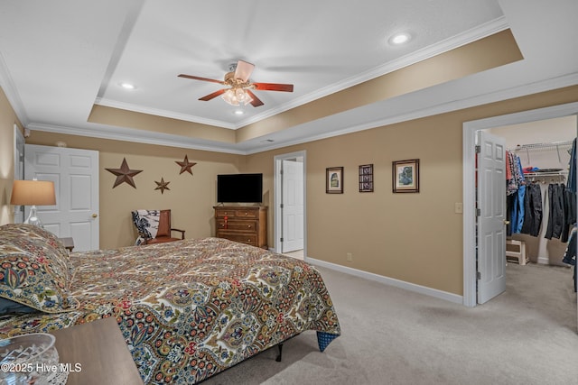 550 Sunset Lakes Blvd SW, Sunset Beach, NC 28468 - bedroom featuring a tray ceiling, crown molding, light carpet, a spacious closet, and recessed lighting