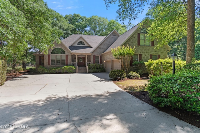 288 Atlantic Ct SW, Supply, NC 28462 - view of front of property featuring brick siding, an attached garage, driveway, and roof with shingles
