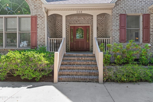288 Atlantic Ct SW, Supply, NC 28462 - property entrance featuring brick siding and a shingled roof