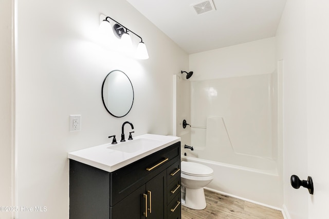 150 Willetts Dr, Southport, NC 28461 - full bath with vanity, toilet, wood finished floors, and shower / bath combination