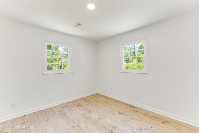 150 Willetts Dr, Southport, NC 28461 - spare room with wood finished floors, baseboards, and healthy amount of natural light