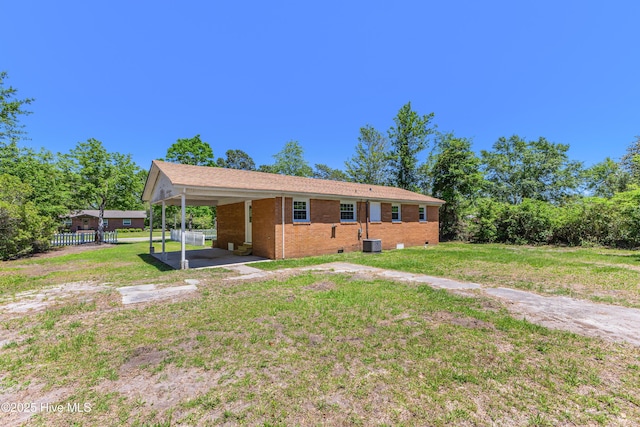 150 Willetts Dr, Southport, NC 28461 - single story home featuring brick siding, cooling unit, and an attached carport