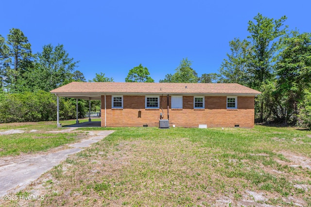 150 Willetts Dr, Southport, NC 28461 - ranch-style home featuring crawl space, a carport, a front yard, and brick siding