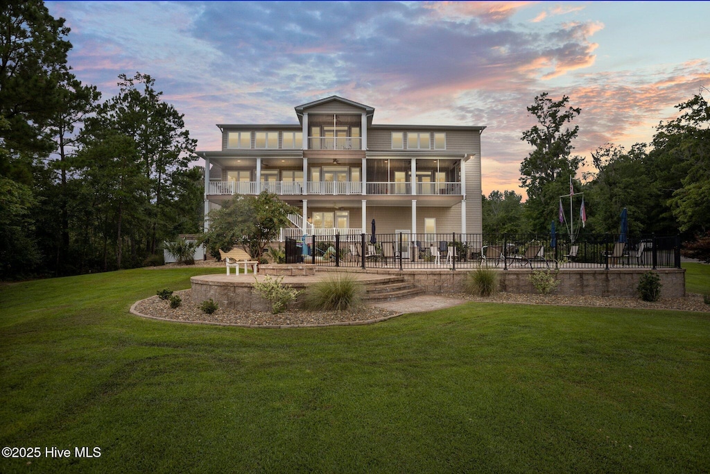 506 Long Point Rd, Chocowinity, NC 27817 - back of house at dusk with a patio, a balcony, and a sunroom
