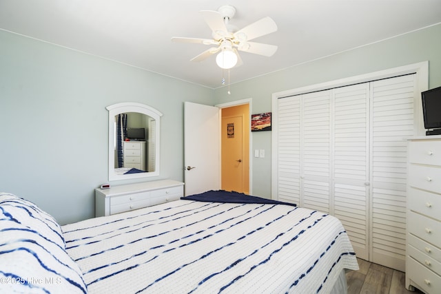 1437 Fort Fisher Blvd S Unit D3, Kure Beach, NC 28449 - bedroom featuring wood finished floors, a closet, and a ceiling fan