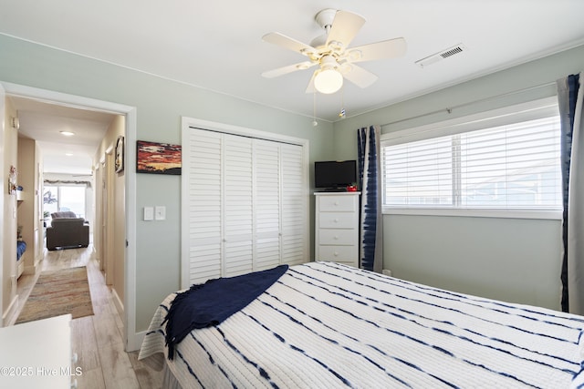 1437 Fort Fisher Blvd S Unit D3, Kure Beach, NC 28449 - bedroom featuring a closet, light wood-style flooring, ceiling fan, and baseboards