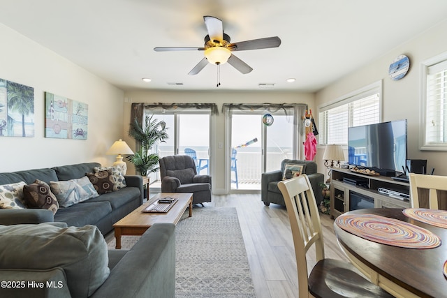 1437 Fort Fisher Blvd S Unit D3, Kure Beach, NC 28449 - living area featuring a ceiling fan and light wood-style flooring