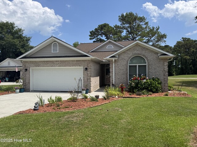 106 N Shore Dr, Sneads Ferry, NC 28460 - ranch-style house with brick siding, concrete driveway, a front lawn, an attached garage, and roof with shingles