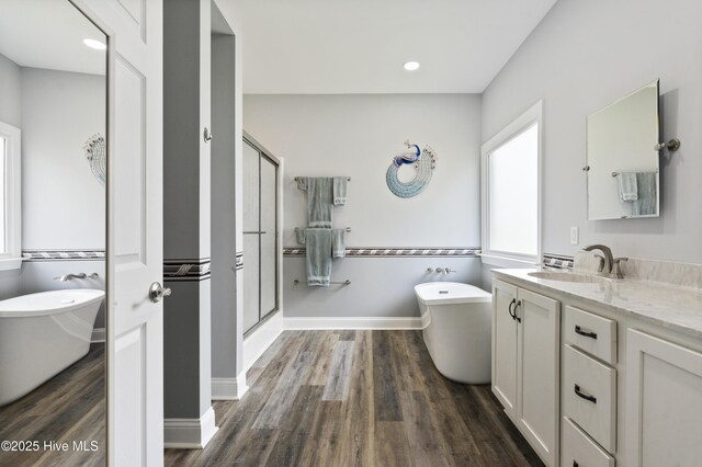 106 N Shore Dr, Sneads Ferry, NC 28460 - full bath with vanity, a stall shower, wood finished floors, a soaking tub, and recessed lighting