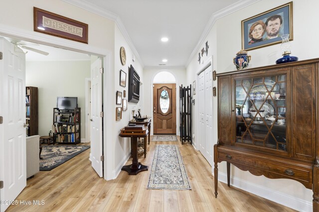 106 N Shore Dr, Sneads Ferry, NC 28460 - foyer with crown molding, light wood finished floors, a ceiling fan, baseboards, and recessed lighting