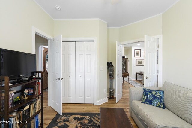 106 N Shore Dr, Sneads Ferry, NC 28460 - living room with wood finished floors, ornamental molding, and baseboards