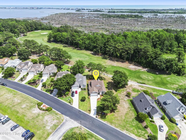 106 N Shore Dr, Sneads Ferry, NC 28460 - aerial view of property and surrounding area featuring a nearby body of water, a golf club, nearby suburban area, and a tree filled landscape