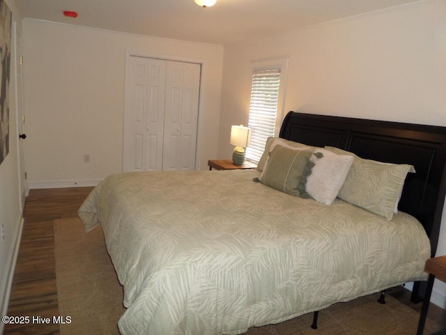 108 Swan Point Rd, Bayboro, NC 28515 - bedroom with wood finished floors, a closet, and baseboards
