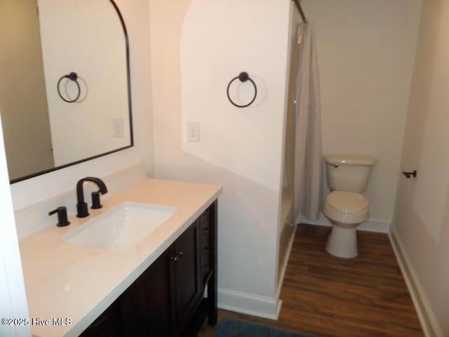 108 Swan Point Rd, Bayboro, NC 28515 - full bathroom with wood finished floors, vanity, toilet, baseboards, and shower / bath combo