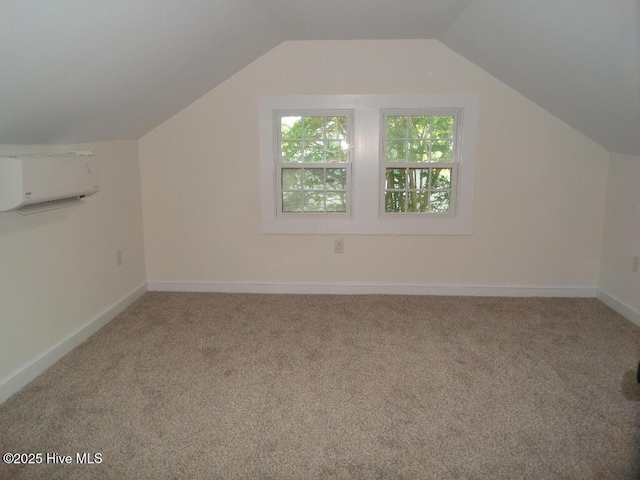 108 Swan Point Rd, Bayboro, NC 28515 - bonus room with carpet, vaulted ceiling, baseboards, and a wall mounted air conditioner