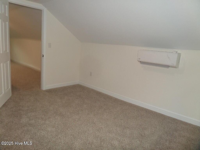 108 Swan Point Rd, Bayboro, NC 28515 - additional living space featuring carpet floors, lofted ceiling, an AC wall unit, and baseboards