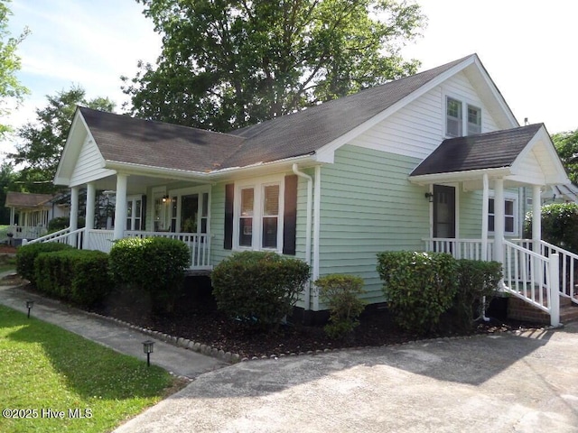 108 Swan Point Rd, Bayboro, NC 28515 - view of front of house featuring a porch and roof with shingles