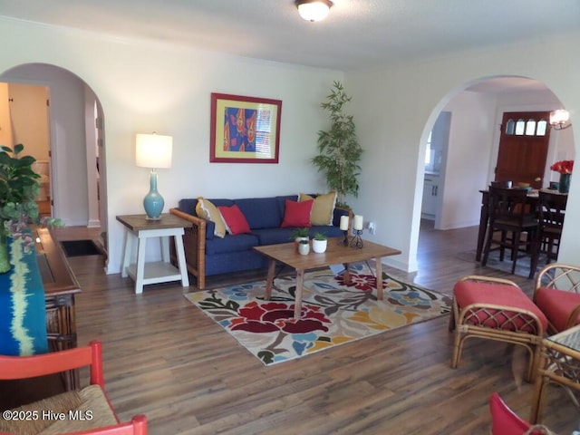 108 Swan Point Rd, Bayboro, NC 28515 - living area with arched walkways, wood finished floors, and baseboards