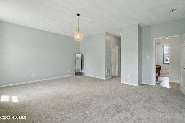 118 Stedman Ln E, Elizabeth City, NC 27909 - unfurnished living room featuring carpet and baseboards