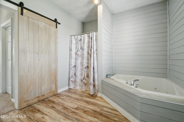 118 Stedman Ln E, Elizabeth City, NC 27909 - bathroom with a whirlpool tub, wood finished floors, curtained shower, and baseboards
