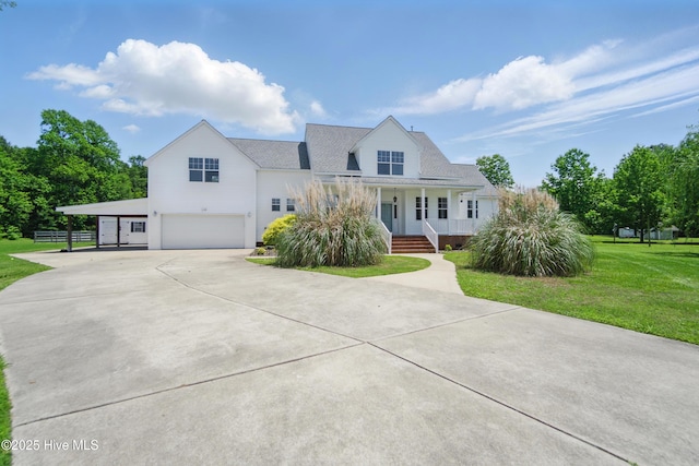 118 Stedman Ln E, Elizabeth City, NC 27909 - view of front of property featuring an attached garage, concrete driveway, a porch, and a front lawn