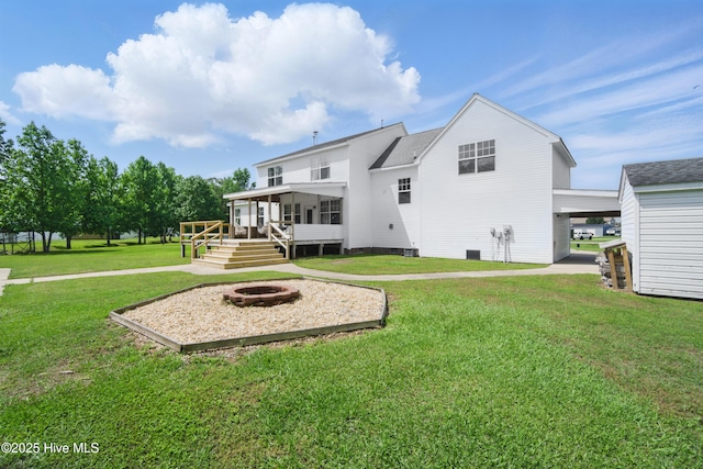 118 Stedman Ln E, Elizabeth City, NC 27909 - back of house with a fire pit, a yard, and a deck